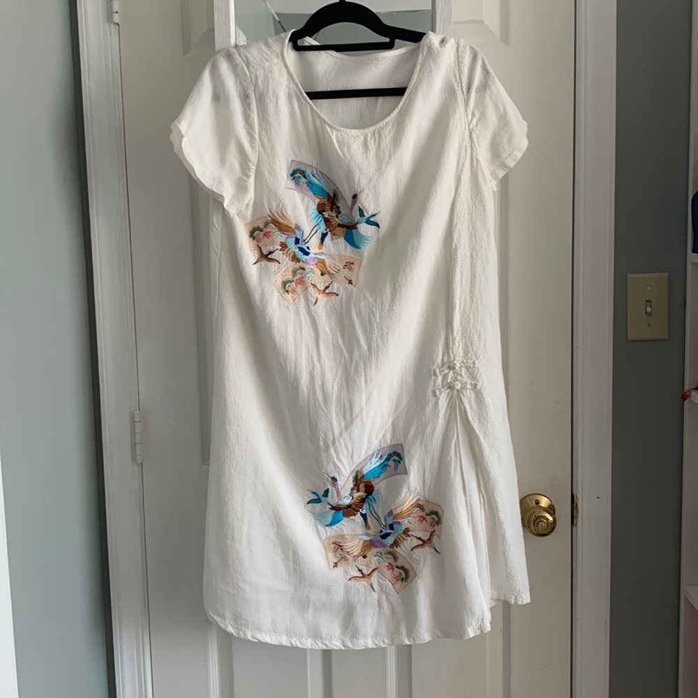 white dress with bird design